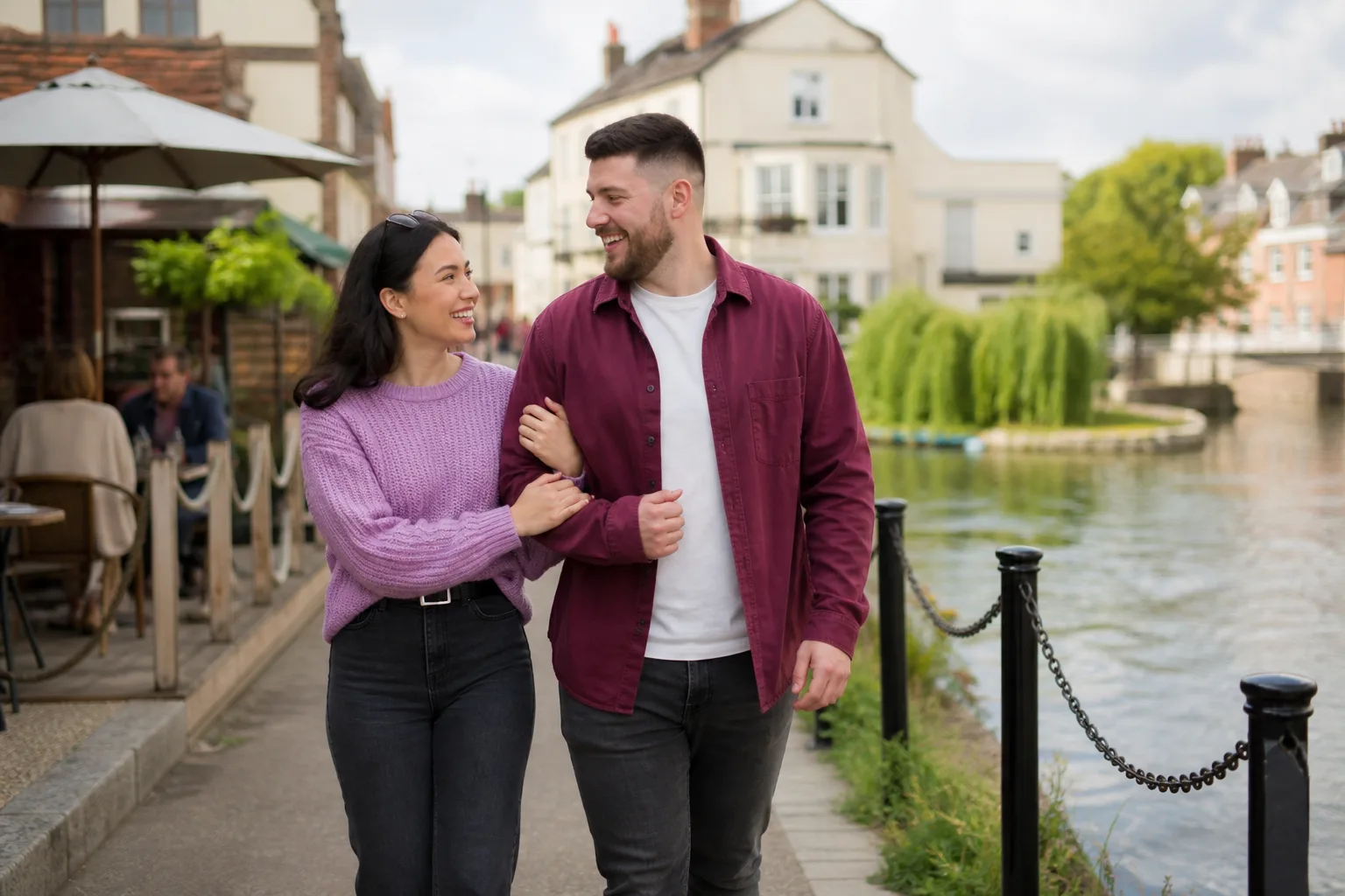Two people talking beside the lake in Mote Park, Maidstone